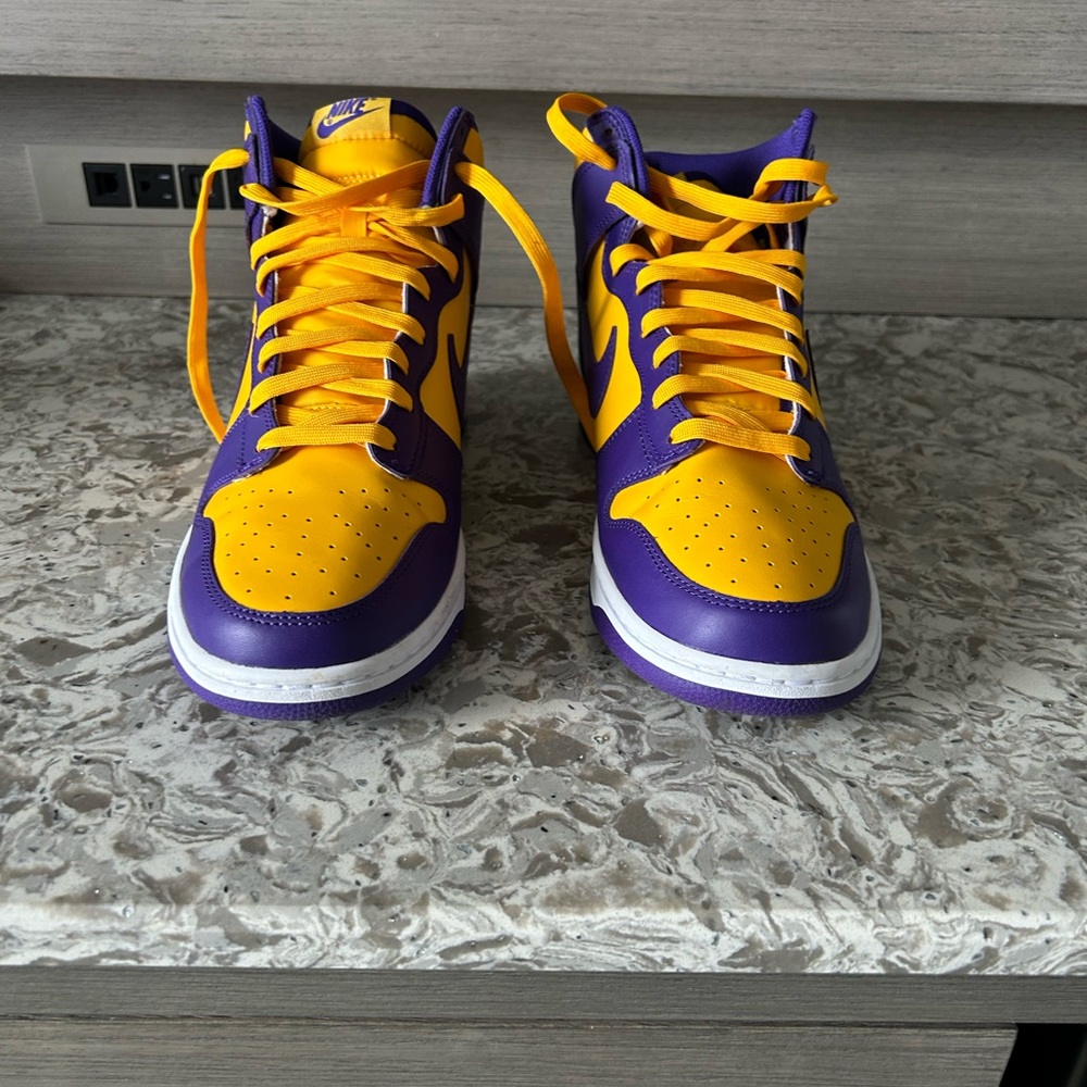 The Nike Dunk High Retro 'Lakers' drapes